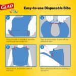 A stack of 30 Glad for Kids disposable paper bibs, showing the colorful shark pattern and crumb catcher pocket.