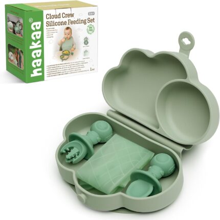 A haakaa Cloud Crew 5-piece green silicone baby travel feeding set with a foldable plate, bib, spoon, fork, and travel bag.