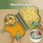 A haakaa Cloud Crew 5-piece green silicone baby travel feeding set with a foldable plate, bib, spoon, fork, and travel bag.