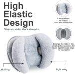 Light grey KAKIBLIN infant travel pillow with a heart shape, providing head and neck support for babies.