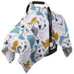 Close-up of a Rquite muslin car seat cover with a dinosaur pattern, draped over an infant car seat.