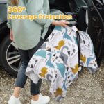 Close-up of a Rquite muslin car seat cover with a dinosaur pattern, draped over an infant car seat.