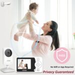 White VTimes VT31 baby monitor with camera and 2.4-inch parent unit, showing a clear view of a sleeping baby.