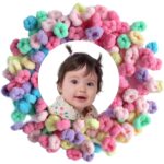 A pile of colorful WDGROW mini hair ties, suitable for babies, toddlers, and adults with fine hair, in a resealable bag.